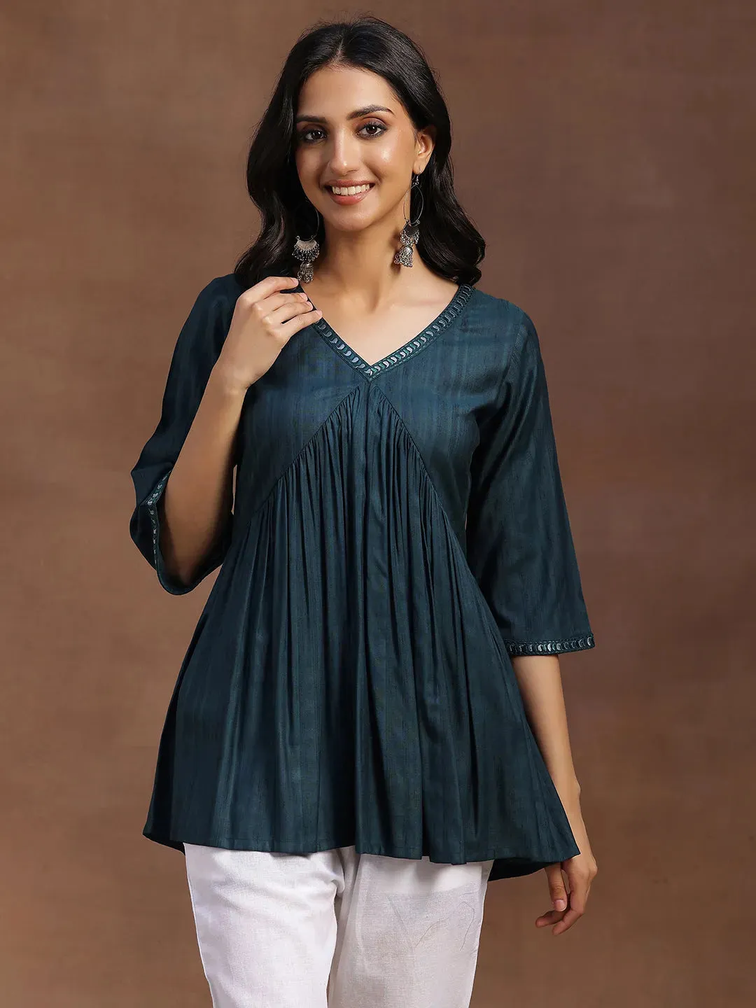 29147.Main_75fc7ad0-7a3c-45e7-b01f-45baa50c165a-1.webp Green Solid Rayon A-line Kurti - Image 1